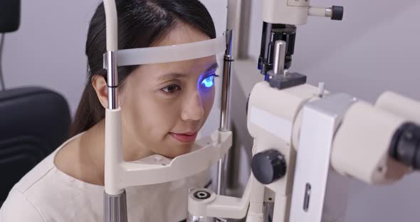 Woman check on eye inside clinic