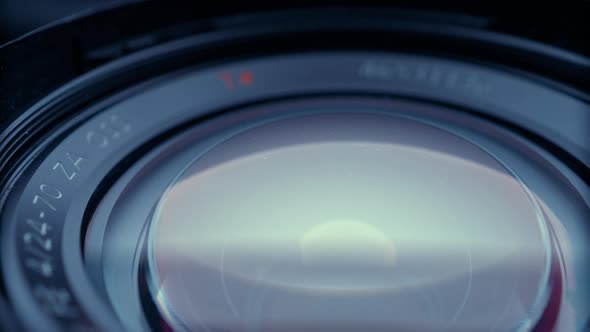 the lens of a movie camera or photo camera is shot in close-up