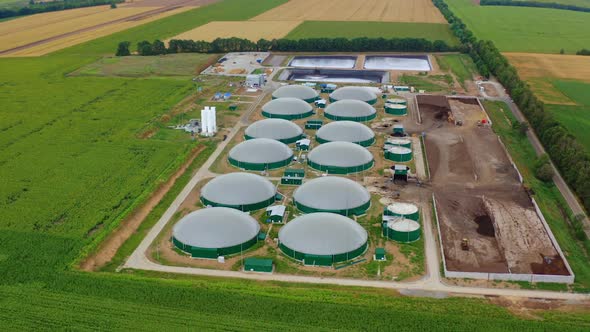 Agricultural biogas plant. Aerial view of green biogas plant storage tanks