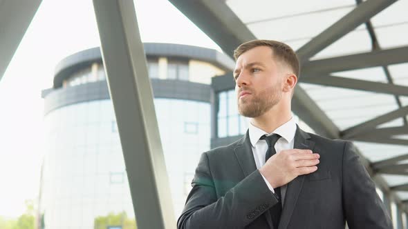 A Well Dressed Happy Bearded Office Corporate Male Executive Standing Outside a Modern Corporate