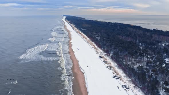 Hel peninsula and snowy beach. Winter Baltic Sea. Aerial view