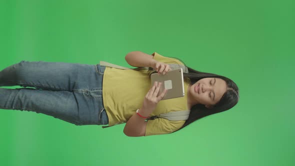 Asian Girl Student Use Tablet And Walking To School On Green Screen Chroma Key
