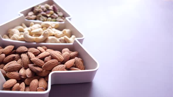 Close Up of Many Mixed Nuts in a Bowl on Table