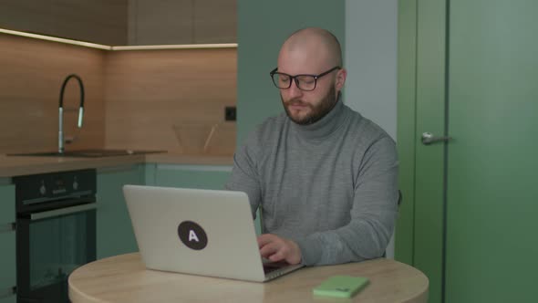 Young Adult Man Using Laptop