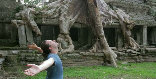 Man Raising Arms In Preah Khan Temple
