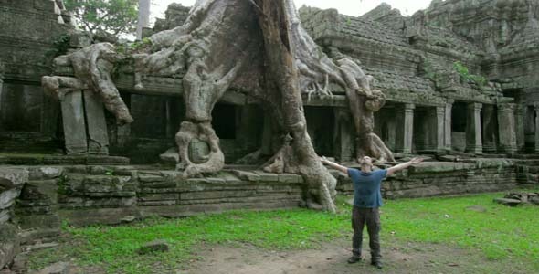 Man Raising Arms In Preah Khan Temple