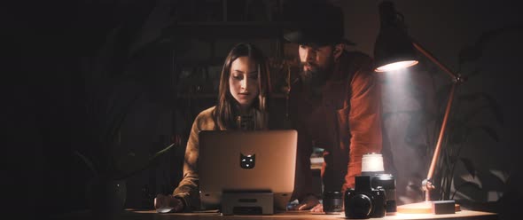 Man and Woman work together at desk