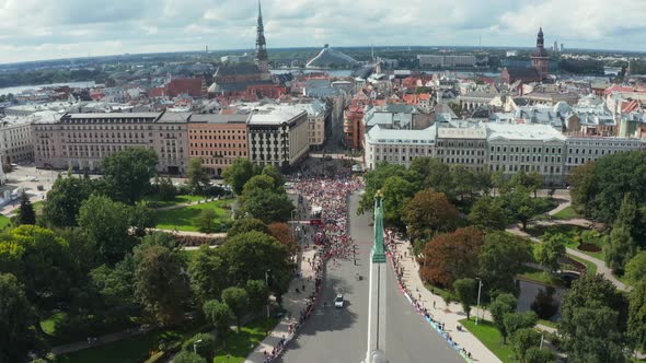 Aerial View on Crowd of People Who are Running a Marathon in Riga