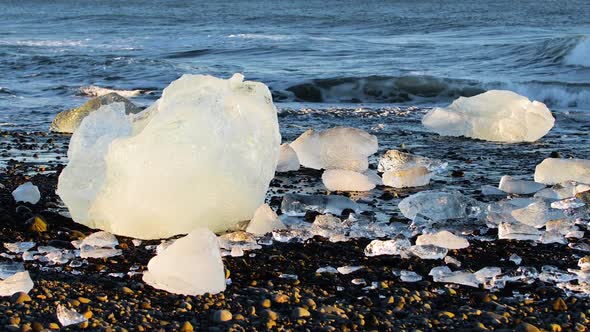 Chunks of Ice on Black Sand Global Warming Climate Change Concept Icebergs in Jokulsarlon Glacier