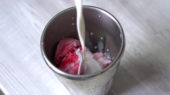 Adding Milk to Milk Shake Smoothie with Ice Creame