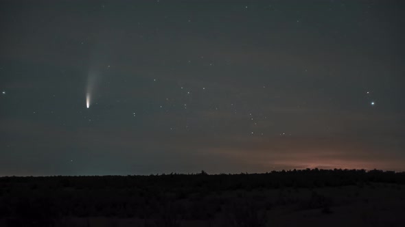 The Comet Moves Across the Night Sky Among the Stars