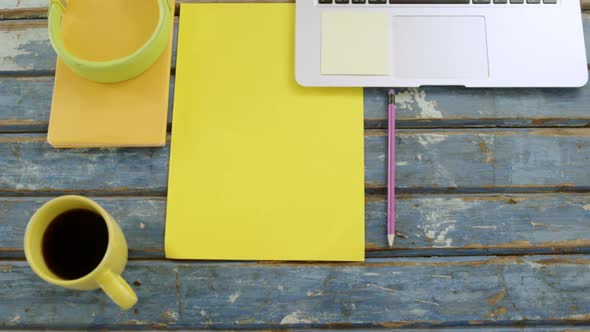 Headphones, organizer, pencil, coffee and laptop on table 4k