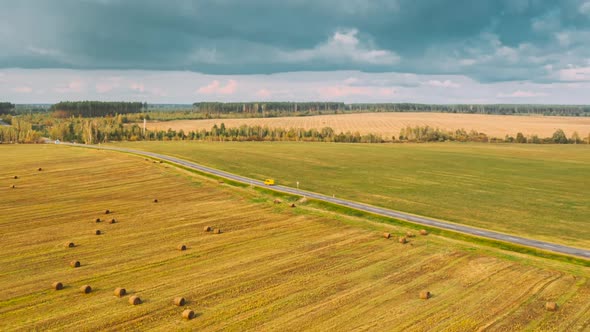 Aerial View Of Sunset Bright Sky Above Summer Hay Field Landscape