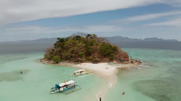 Small Torpic Island with a White Sandy Beach Top View