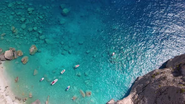 Zakynthos island, Greece. Secluded beach with white rock formation near Keri with blue lagoon, touri