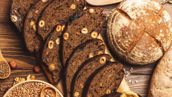 Whole Grain Multigrain Bread, Whole and Sliced, Contains Seeds Isolated on Black