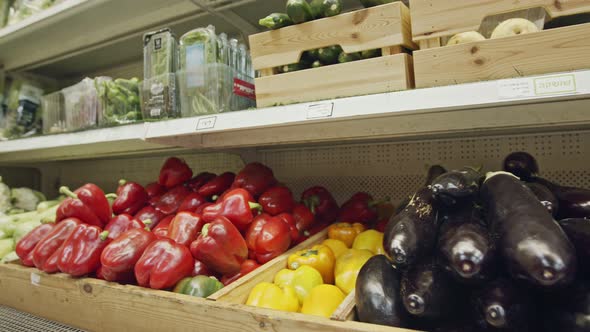 Large variety of vegetables and fruits on a supermarket shelves