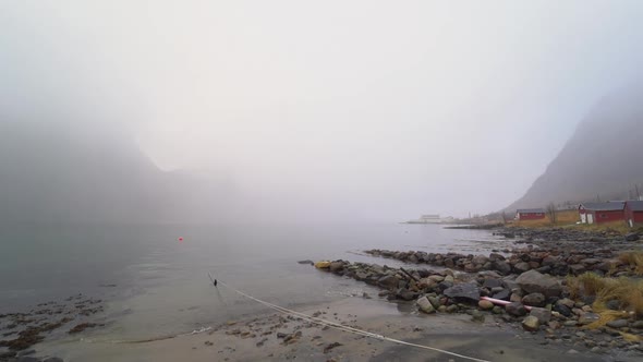 Misty Mountains Over Fjord