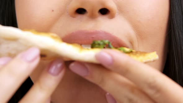 Unrecognizable Woman Eating Pizza Posing Over White Background Closeup