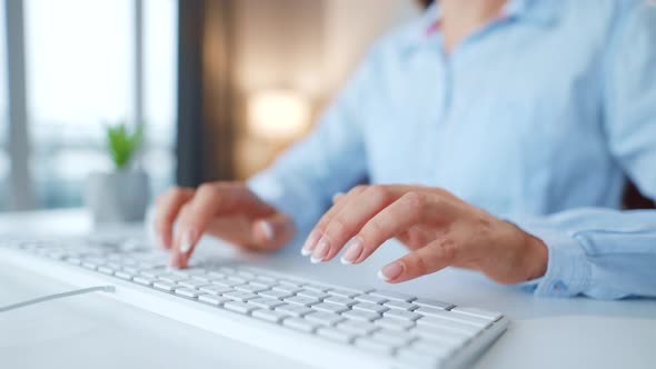 Female Hands Typing Computer Keyboard