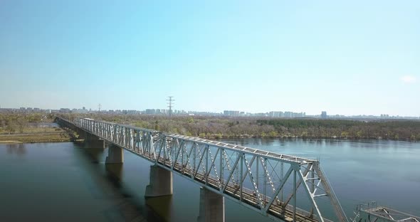 A Train Crossing a Bridge Over a Body of Water