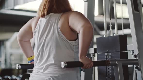 Overweight Woman Doing Dips