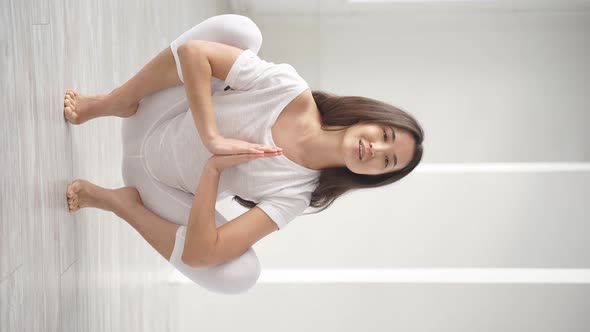 Young Brunette Pregnant Yoga Model Working Out Performing Garland Pose