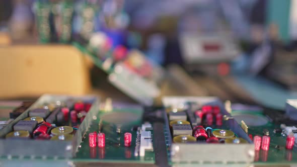 Slider Shot of a Connectors Component and Large Green Microcircuit in Workshop Laboratory