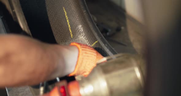 Close View of Gluing a Patch on the Tire on Auto Service