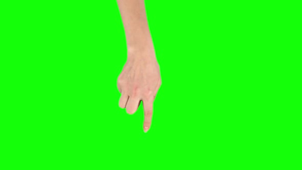 Female Hand Is Performing Rotate at Tablet Screen Gesture on Green Screen. Close Up