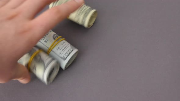 A Roll of Dollar Bills White Powder in a Transparent Bag