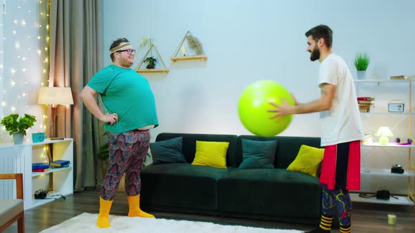 In the Living Room Obese Guy Doing a Funny Workout