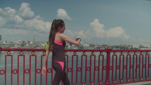 Sporty Woman Jogger Relaxing After Workout in City