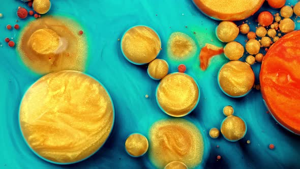 Gold Liquid Paint Bubbles. Abstract Color Background. Real Beautiful Substance Flows.