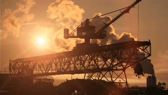 Industrial Crane Construction Scenery At Sunset. Economy Growth Concept Background