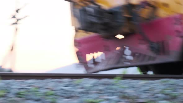 Diesel locomotives run on tracks to stop at the Lamphun Railway Station.