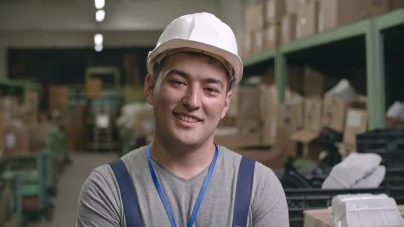 Portrait of Smiling Asian Factory Worker