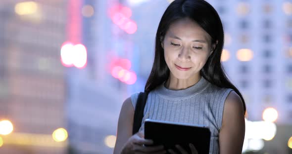 Woman using tablet computer