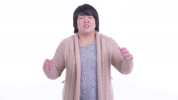 Stressed Overweight Asian Woman Getting Bad News for Winter