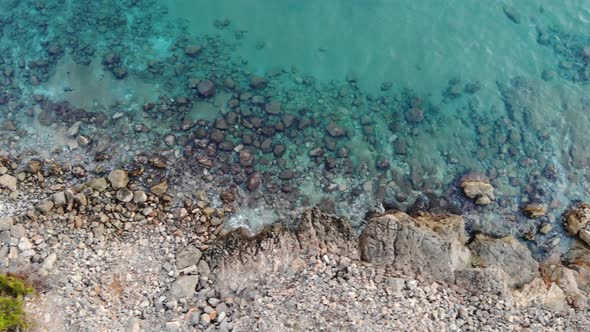 Beautiful aerial view of cliff with the sea, a clear blue and turquoise sea with crystal clear and c