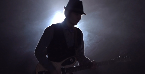 Plucking Strings of Guitar alt