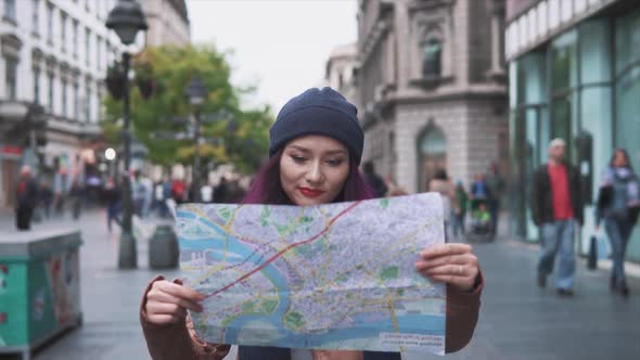 Pretty Tourist Girl Examining the Map of the City