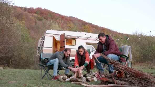 Group of Friends Preparing the Camping Fire