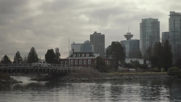 Car driving through small bridge on Dead man island In Vancouver