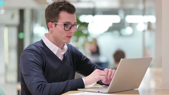 Young Businessman Talking on Video Call on Laptop 