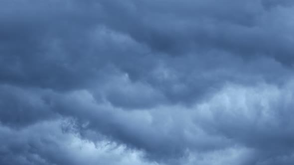 Dark clouds with dark gray sky, time lapse, background.