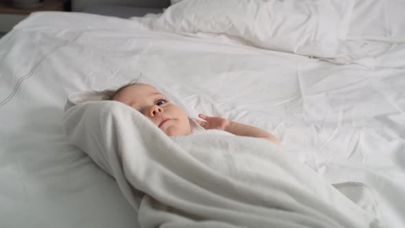 Video of cute caucasian baby after the bath. Shot with RED helium camera in 8K.