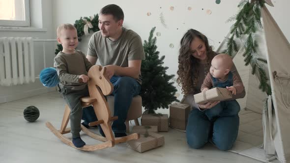 Happy Young Family Enjoying Christmas Day