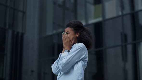 Depressed Businesswoman Crying at Office Building