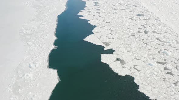 Slow Flight of a Drone Over Floating Ice in a Strait Among Solid Ice